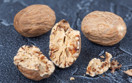 large dry nutmeg closeup on dark backgroundの写真素材