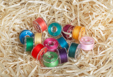 set of sewing threads, red, green, blue on spoolsの写真素材