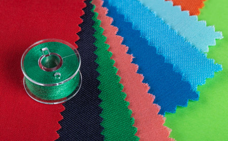bobbins for a sewing machine with multi-colored threads.