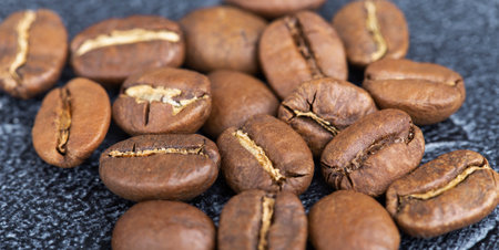 background of fresh roasted coffee beans, top viewの写真素材