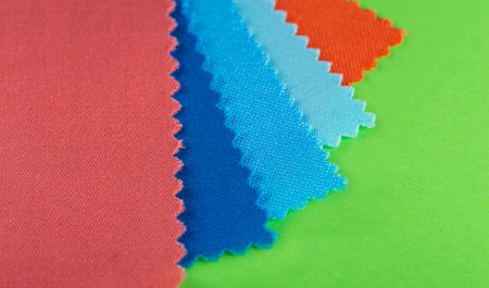 samples of multi-colored textured fabric on a bright backgroundの写真素材