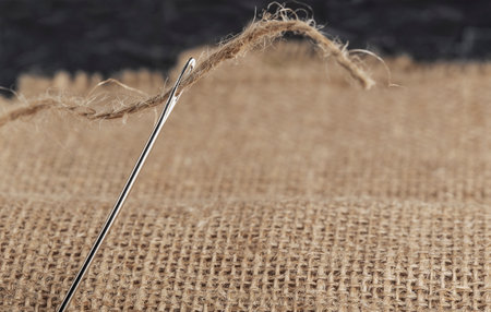 burlap, sewing needle and thick jute thread clo