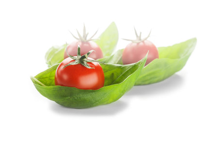 red ripe cherry tomatoes and green basilの写真素材