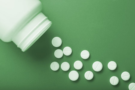 Medical pills. On a green background. View from above.の写真素材