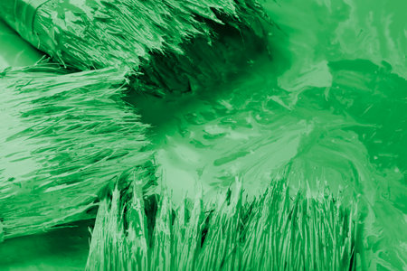 construction brushes with green paint for workの写真素材
