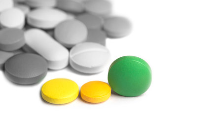many pills on a light background close-up