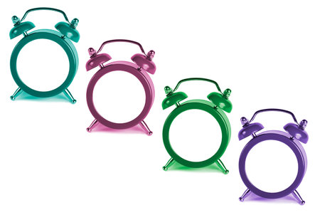 colored alarm clocks without numbers on white backgroundの写真素材