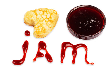 heart shaped pancake, jam drops and glass bowl with jam isolated on white backgroundの写真素材