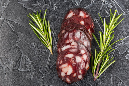 dry sausage sliced ââwith herbs top viewの写真素材