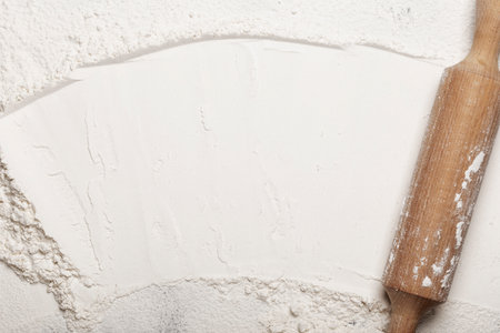 wooden rolling pin and flour top viewの写真素材