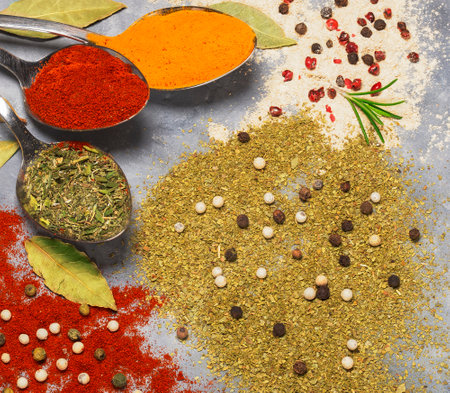 Spices turmeric and paprika in spoons and scattered. Top view.の写真素材