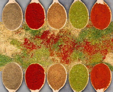 collection of various oriental spices on spoons top viewの写真素材