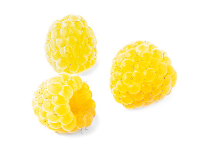 yellow raspberries close-up on white background