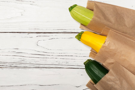 fresh zucchini in paper bags top viewの写真素材