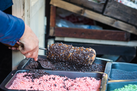pastries sprinkled with chocolate flakes during cookingの写真素材
