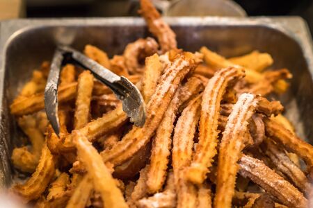 sweet and crunchy bread cooked in an iron bowl for saleの写真素材