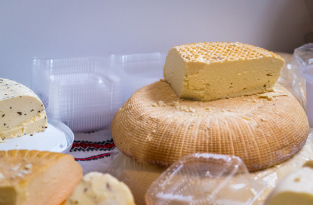 a piece of hard cheese. Big and deliciousの写真素材