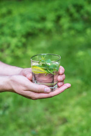 Man holding a glass of waterの写真素材
