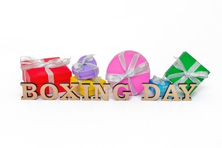 Composition with words BOXING DAY and many gift boxes