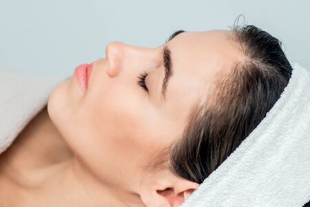 Face of woman with closed eyes ready for skin care and procedures.の写真素材