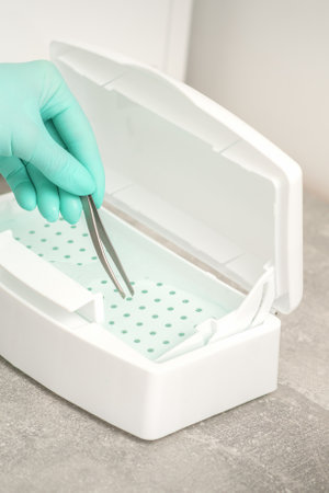 Hand disinfects tweezers with cleaning systems for medical instruments. Ultrasonic cleanerの写真素材