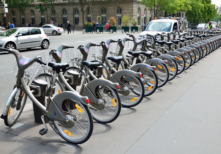 This is Velib station with its distinctive grey bicycles  Velib is a large-scale public bicycle sharing system in Paris のeditorial素材
