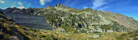 The concrete wall is built in the valley Campan of the Hautes-Pyrenees. There are mountains? Hourquett and Medette in the background.のeditorial素材