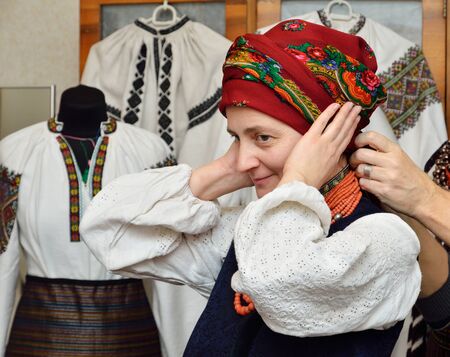 The woman is dressing up a Ukrainian vintage national clothes.の写真素材