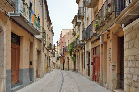 The old-time street is in the historic quarter of the antique Spanish village Montblanc. The town is one of the best preserved in Catalonia.の写真素材