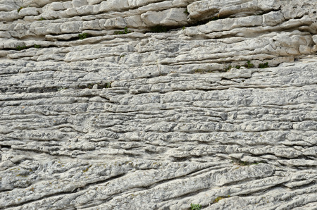 There are many layers of limestone weathered with natural forces.の写真素材