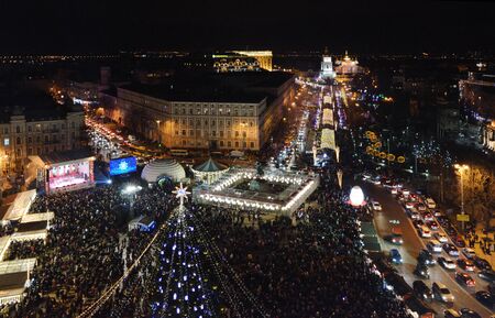 Night Christmas celebration in the central square with a main fir-tree in Kyivの写真素材