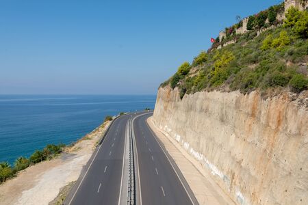 Turkish ñoastal highway along the sea below the steep cliff fixed