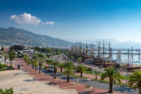 A lot of big old-fashioned restourants in the shape of ships are moored in Turkish city Alanyaの写真素材