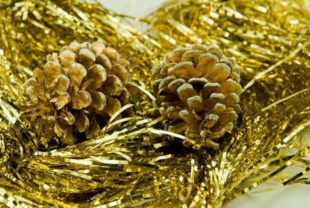 Fur-tree cones among a tinsel. Ornaments by New Year.の写真素材