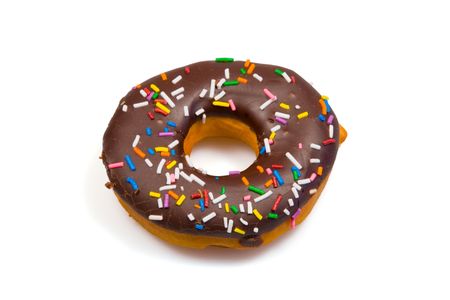 A tempting donut with chocolate icing and colorful sprinkles, isolated on a pure white background.の写真素材