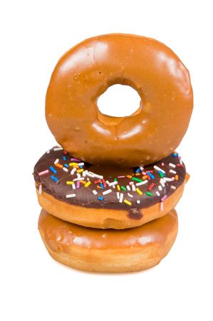 Stack of glazed donuts on a white backgroundの写真素材