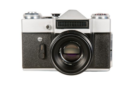 Old model of the film camera on a white background