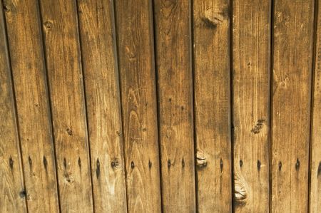 Old wooden wall of brown color with cracks.の写真素材