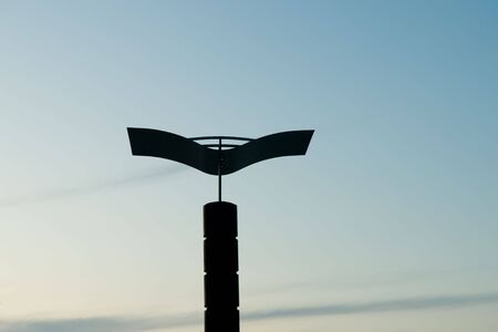 Night lantern in the form of a seagull on seacoastの写真素材