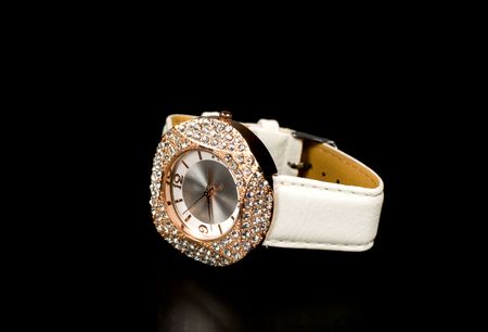 Women's watches with crystals isolated on black background.の写真素材