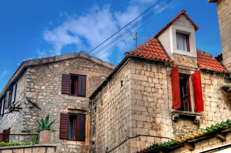 Old stone house against the blue skyの写真素材