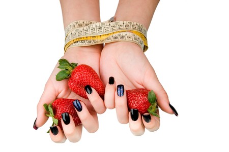 Strawberry in the female connected hands. A diet symbol.の写真素材