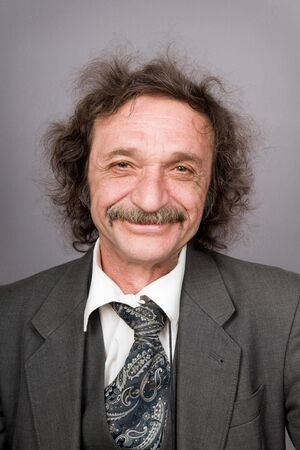 The cheerful man with moustaches and shaggy hair