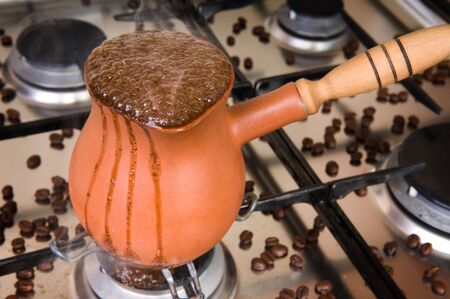 Boiling coffee on a gas cookerの写真素材