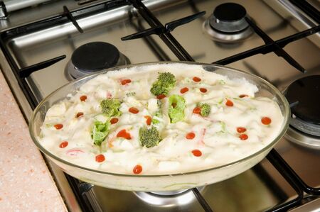 Preparation of a vegetable baked pudding with the shaken up eggsの写真素材