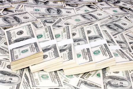 Heap of money in packings, 100-dollar denominations
