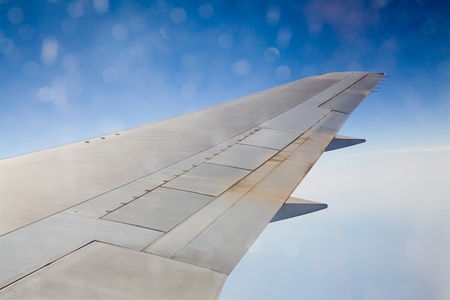 Looking out an airplane cabin view of the wing.の写真素材