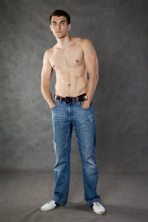 Portrait of beautiful young men on grey backgroundの写真素材