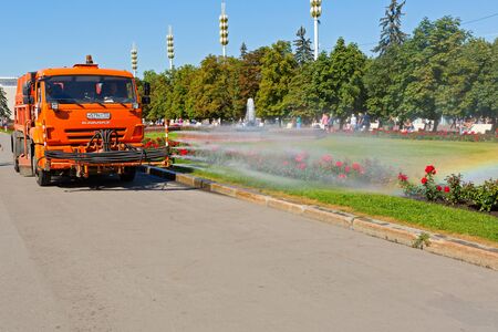 Work watering machine on public park in Moscow, Russiaのeditorial素材