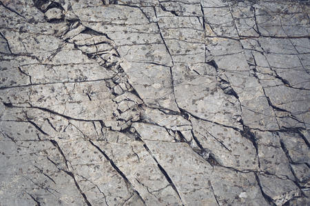 Background with old stone wall with cracksの写真素材